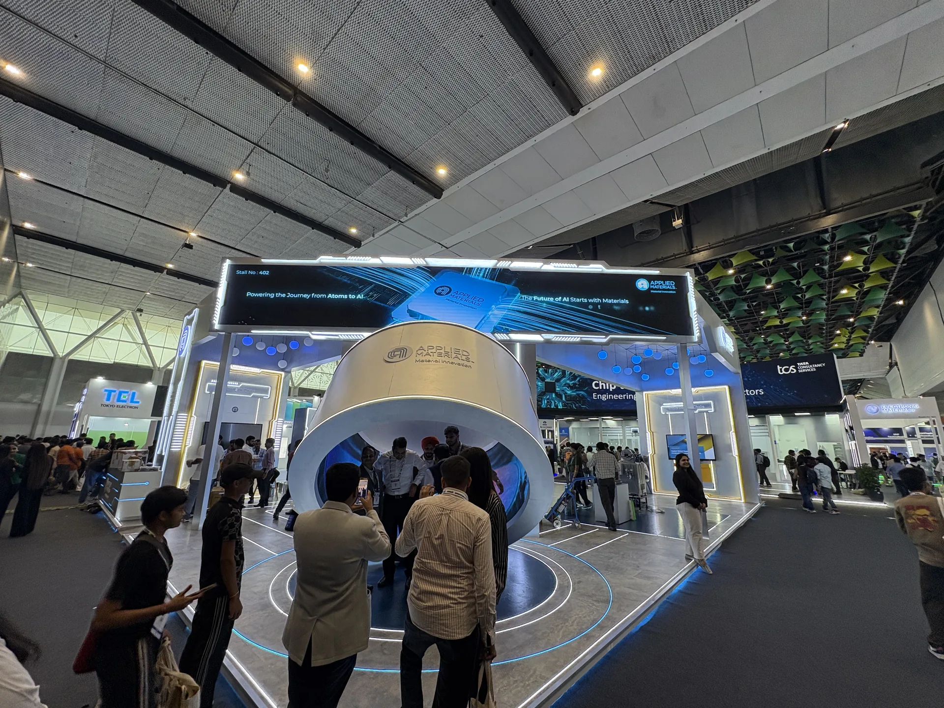 Tokyo Electron TEL booth 402 at SEMICON India 2026 with Atoms to AI and Chip Engineering messaging